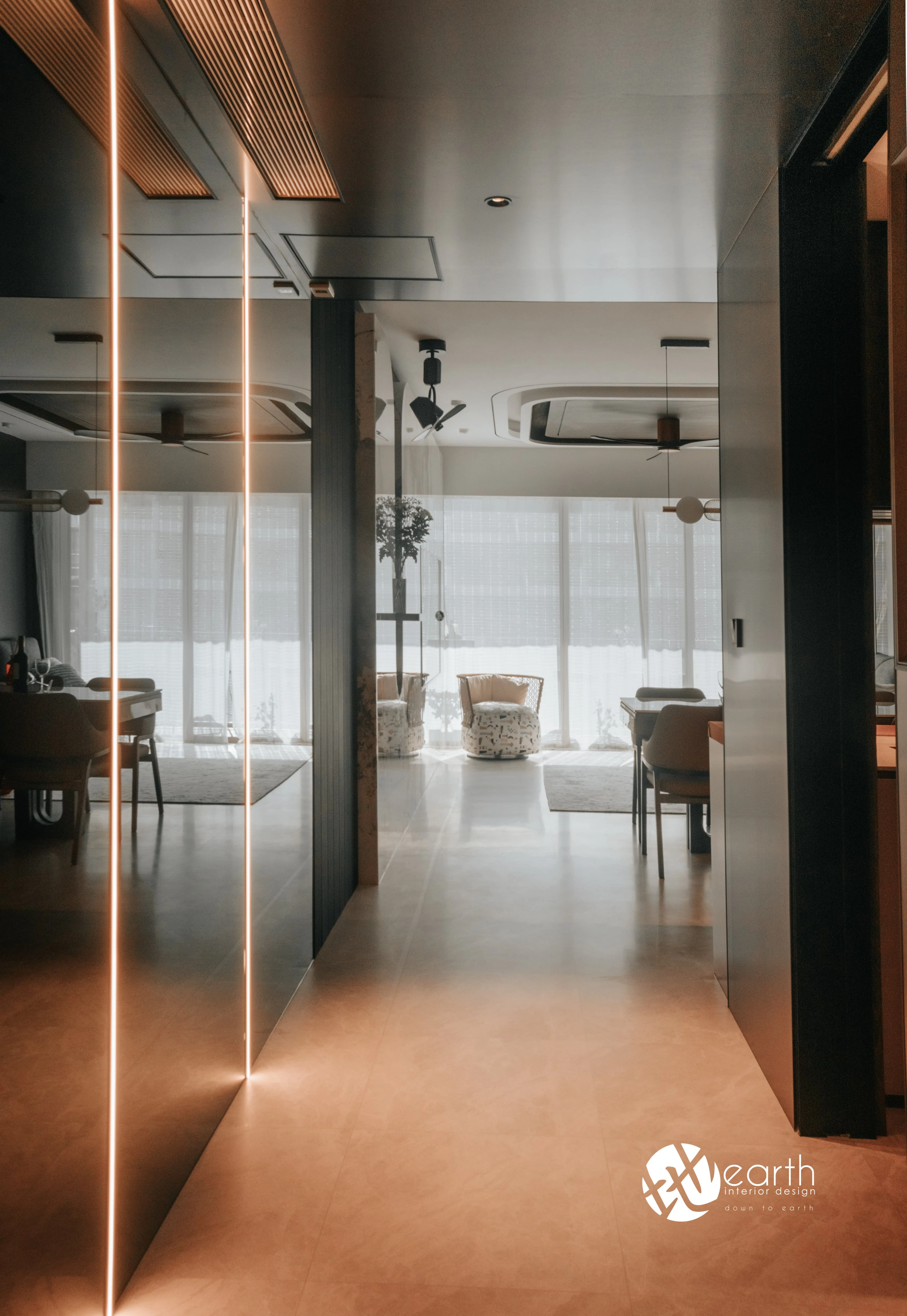 Illuminated walkway leading toward the bedroom at Harbour Lux