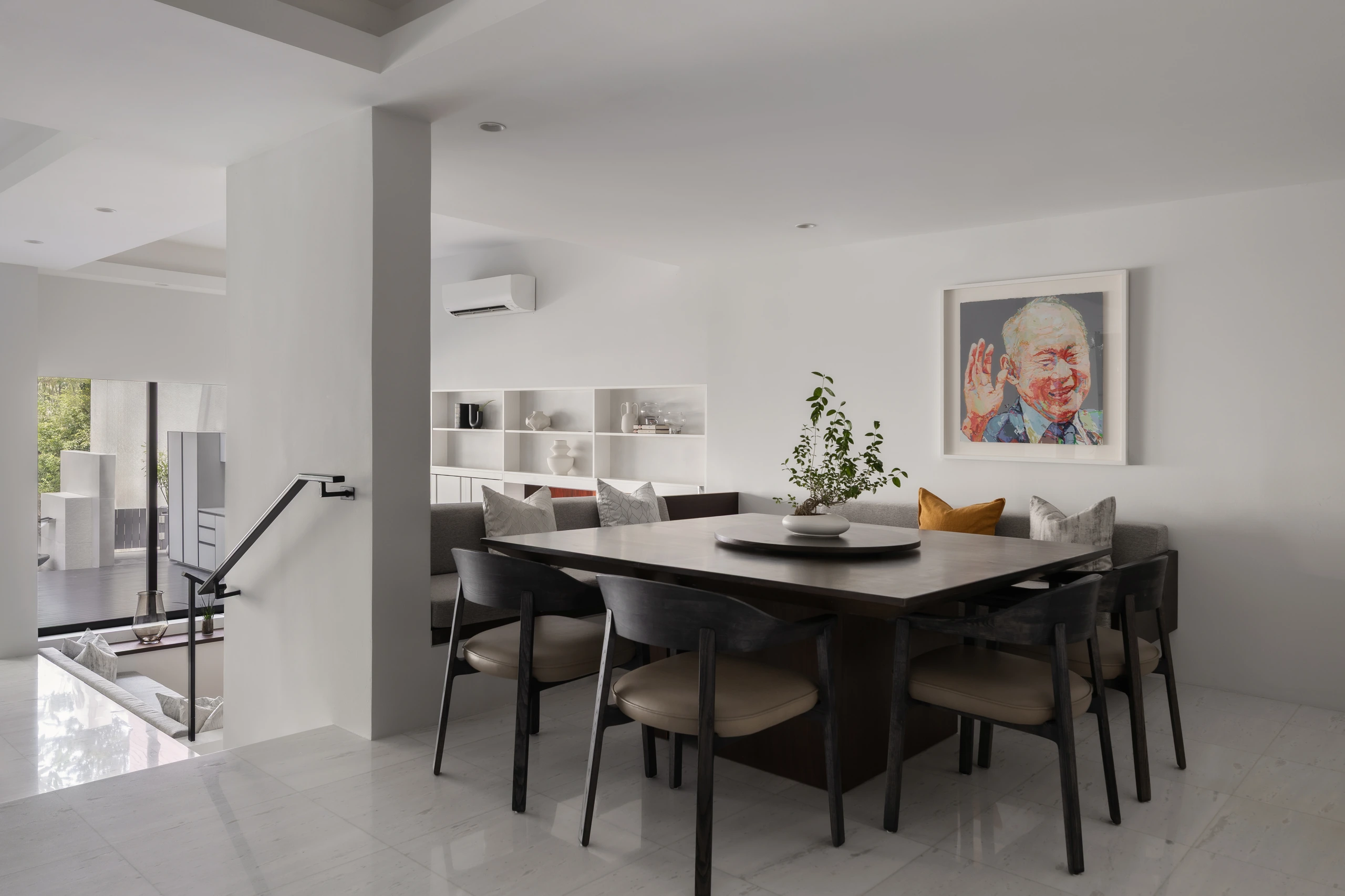Dining area connected to the living room by Edgeline Planners