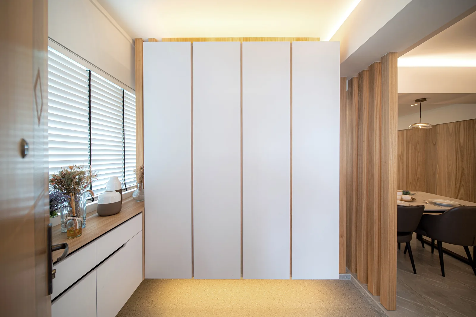J Concept Designers &mdash; suspended white cabinet partition with veneer screen glimpsing into dining