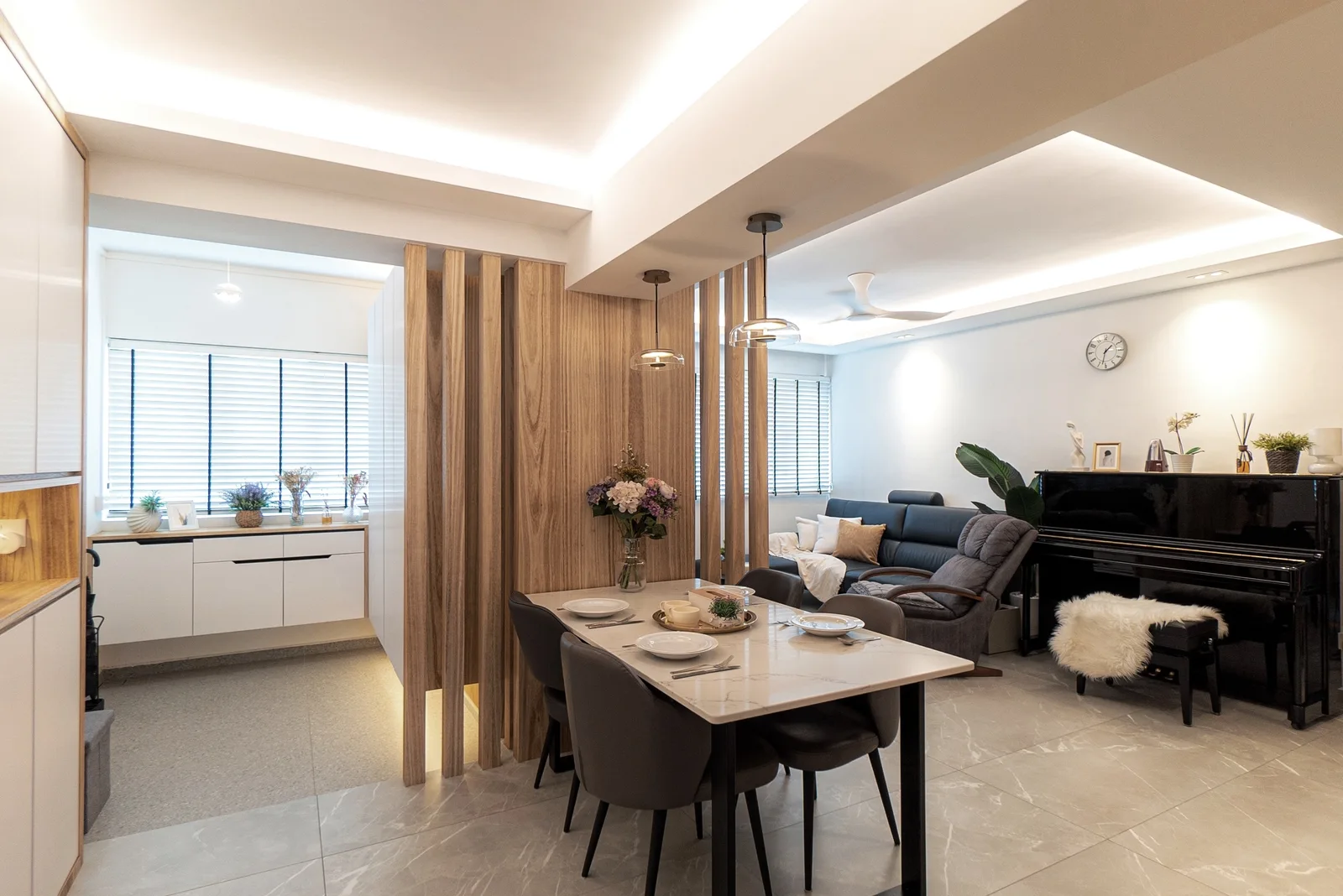 J Concept Designers &mdash; full sweep from entrance through dining to living room with piano