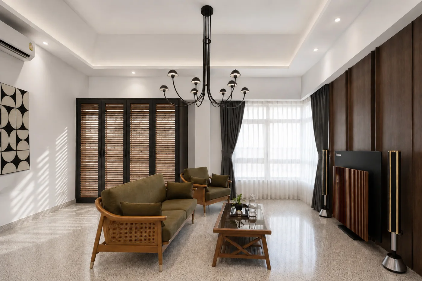 J Concept Designers &mdash; living room with woven-detail seating, trellis doors, walnut TV wall and black chandelier