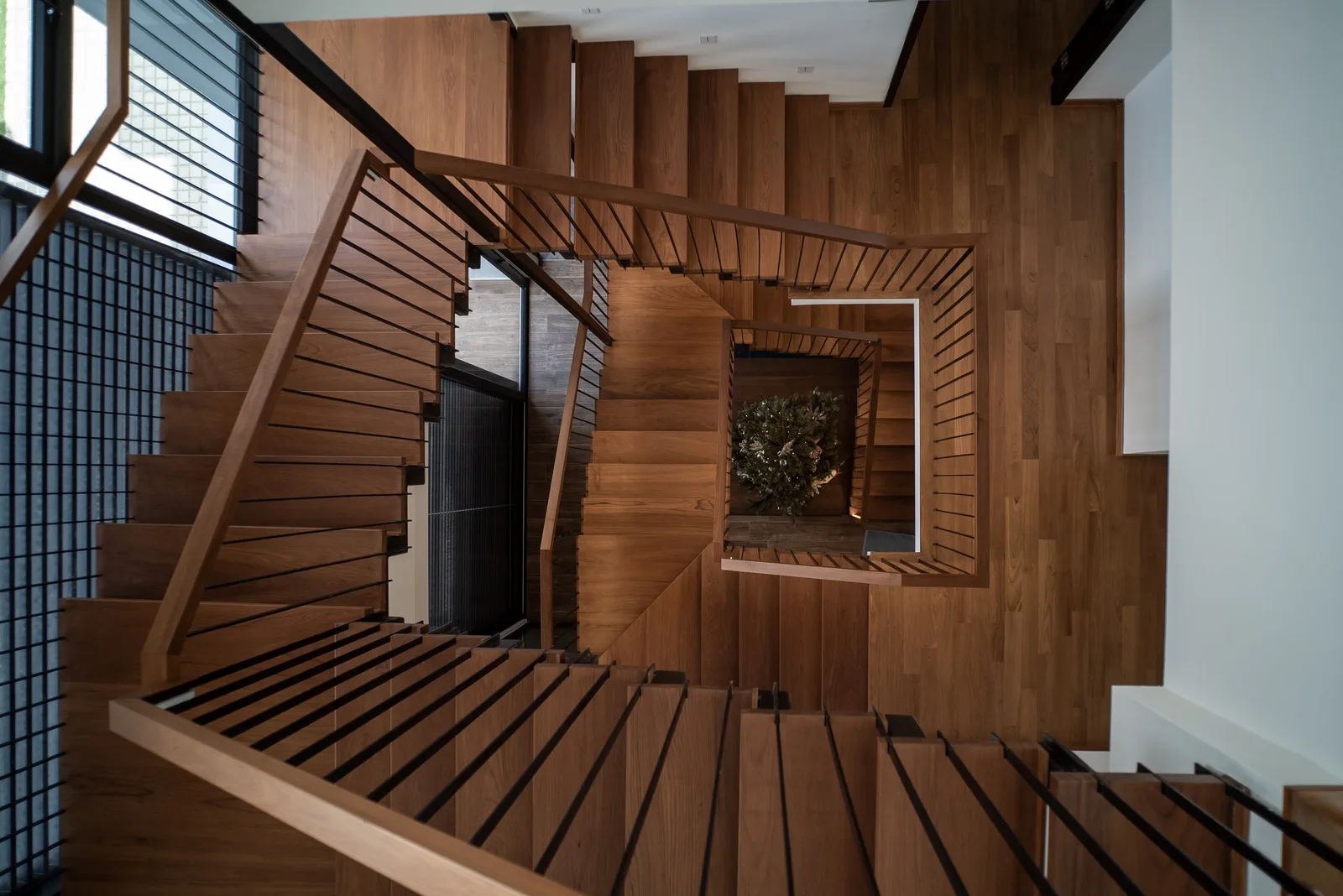 J Concept Designers &mdash; staircase viewed from above, timber treads spiralling downward