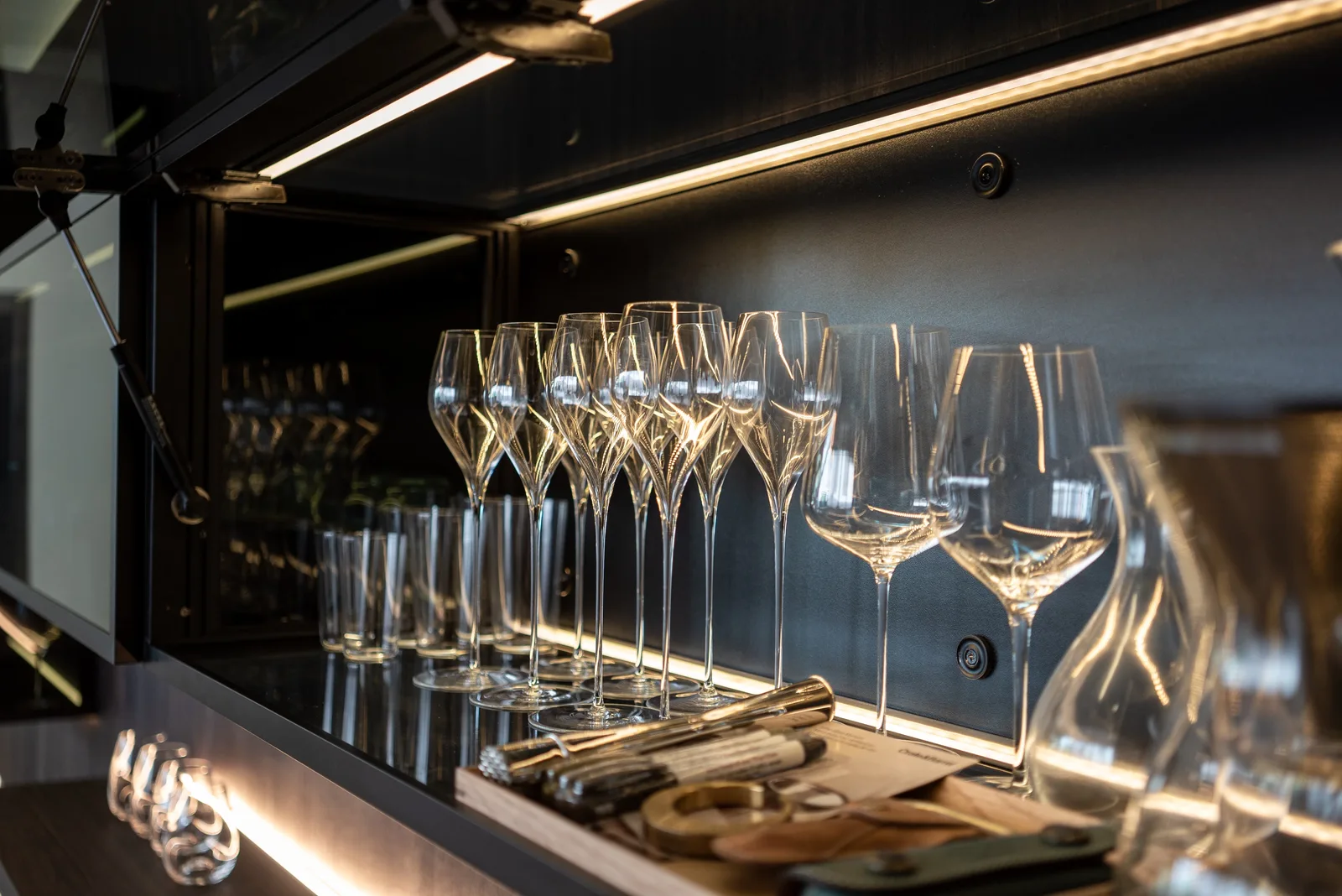 J Concept Designers &mdash; illuminated wine glass display shelf detail with refracting light