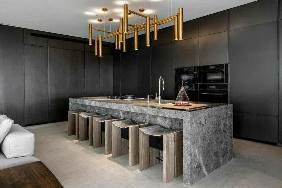 SAOTA Hillside kitchen &mdash; black cabinets with gold luminaire