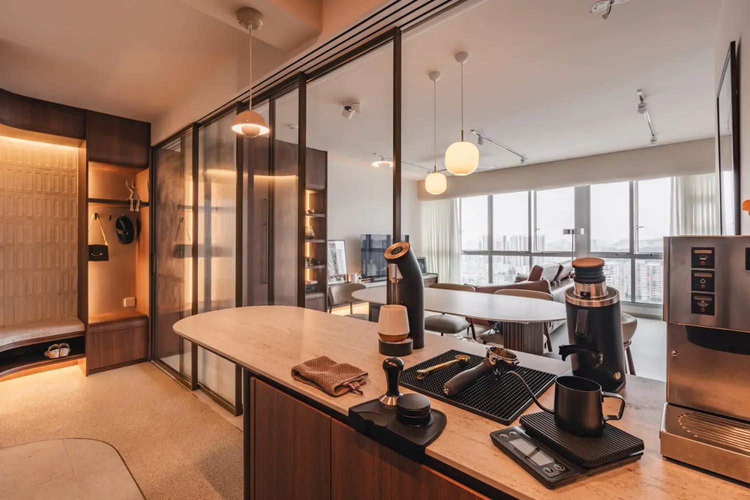Kitchen coffee counter looking through the glass sliding partition towards the living room windows