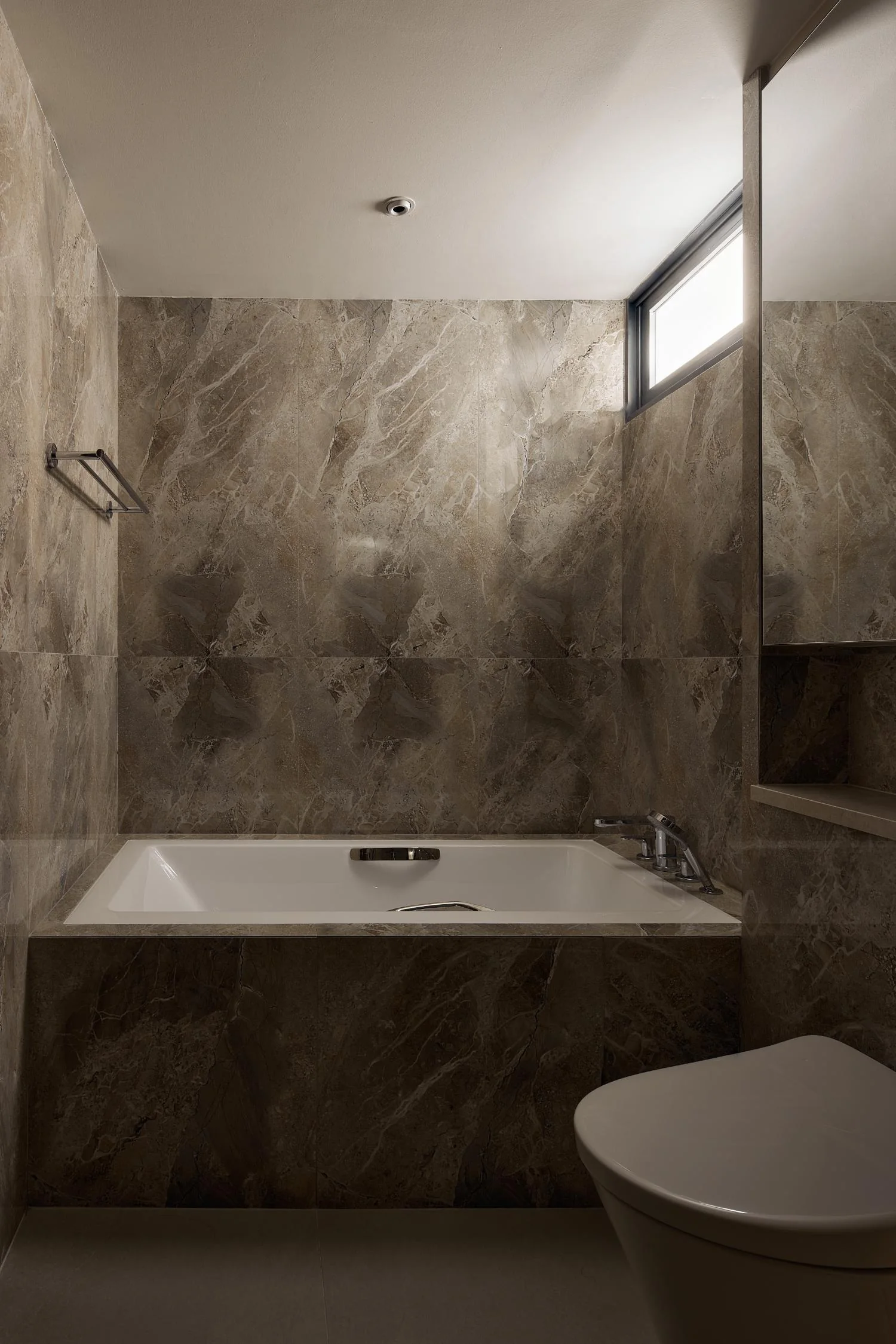 Full-sized bathtub in the master bathroom at Esparina Residences