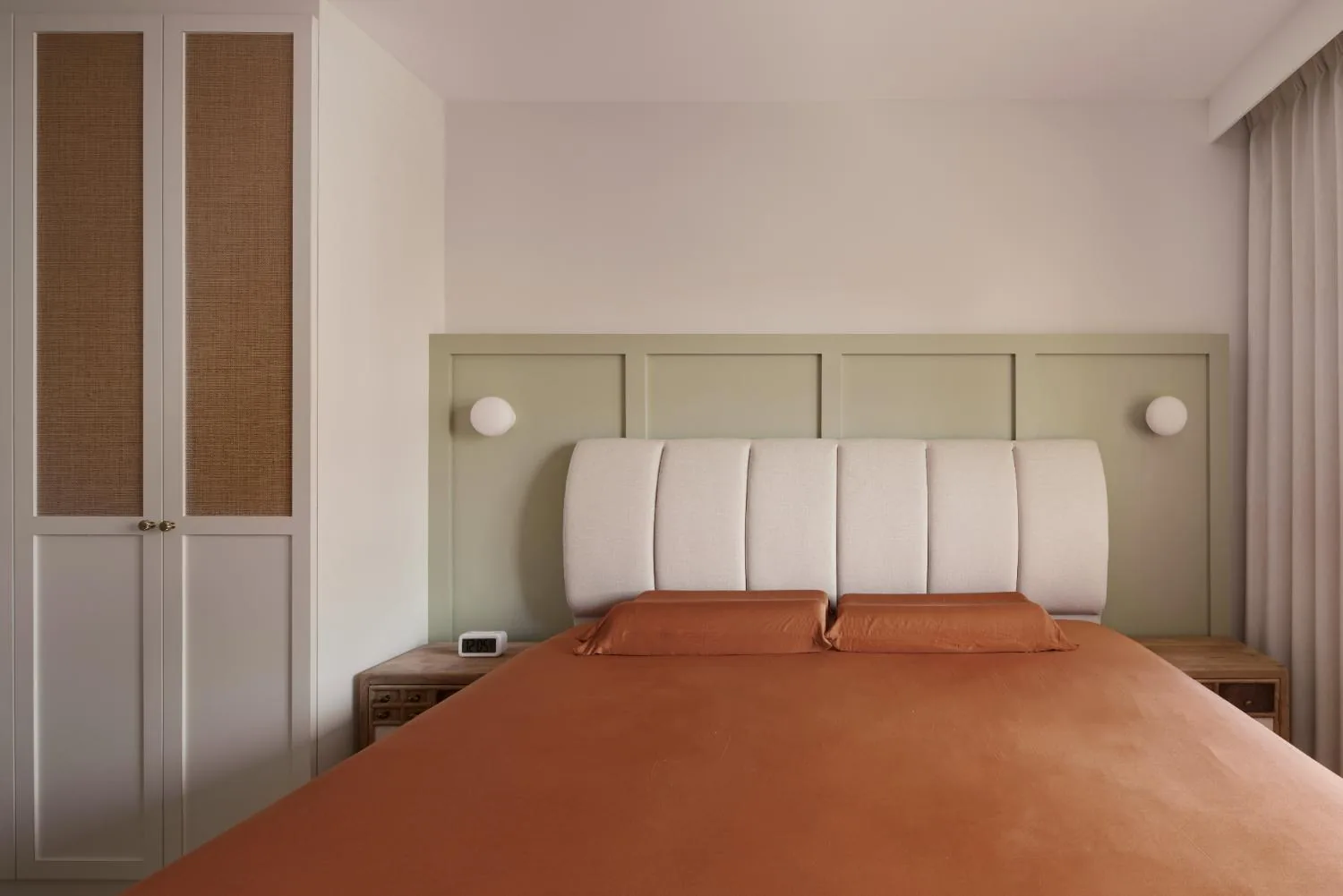Master bedroom in soft cream timber and muted green tones