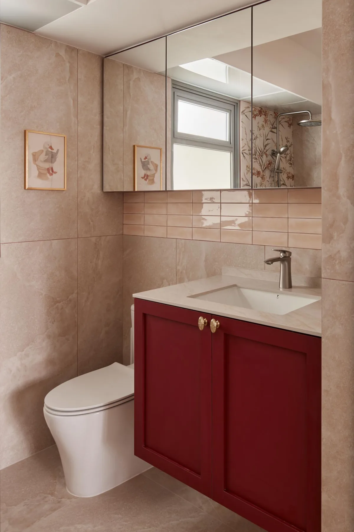 Master bathroom with pink finishes and deep maroon vanity