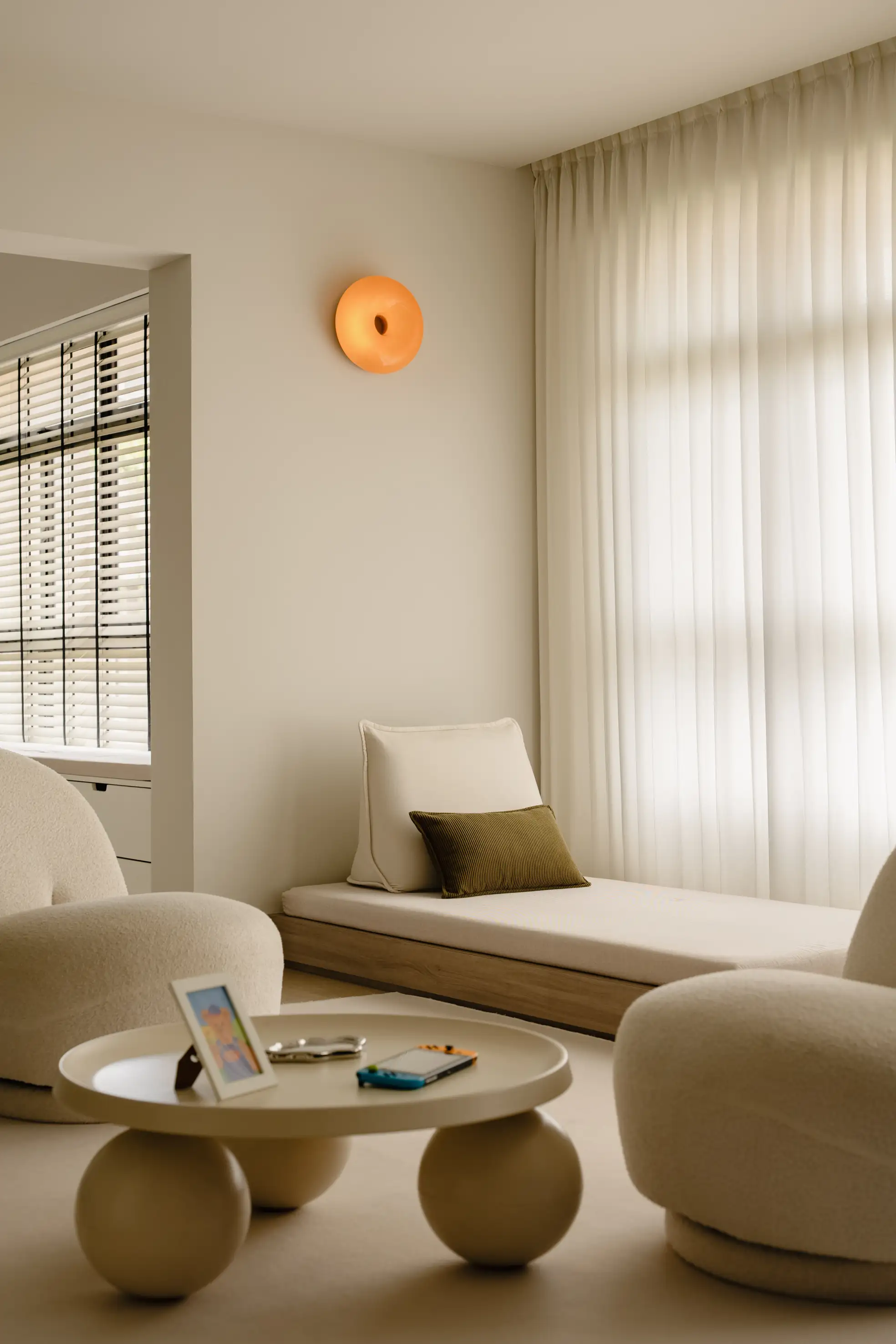 Tengah living room with curved sofa and window seat