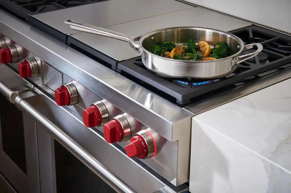 Close view of a pan over a Wolf gas burner