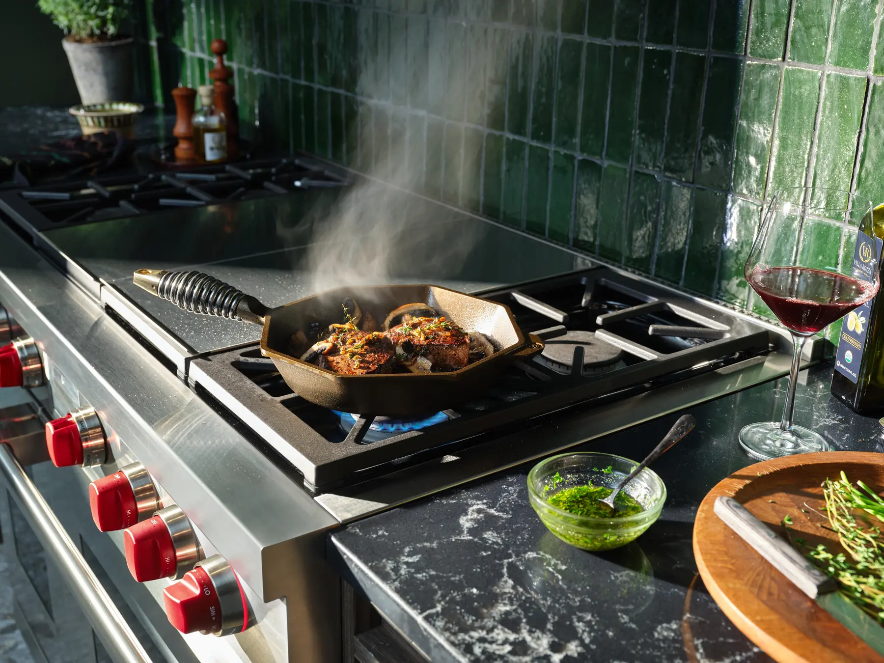 Pan cooking over the gas burners of a Wolf Dual Fuel Range