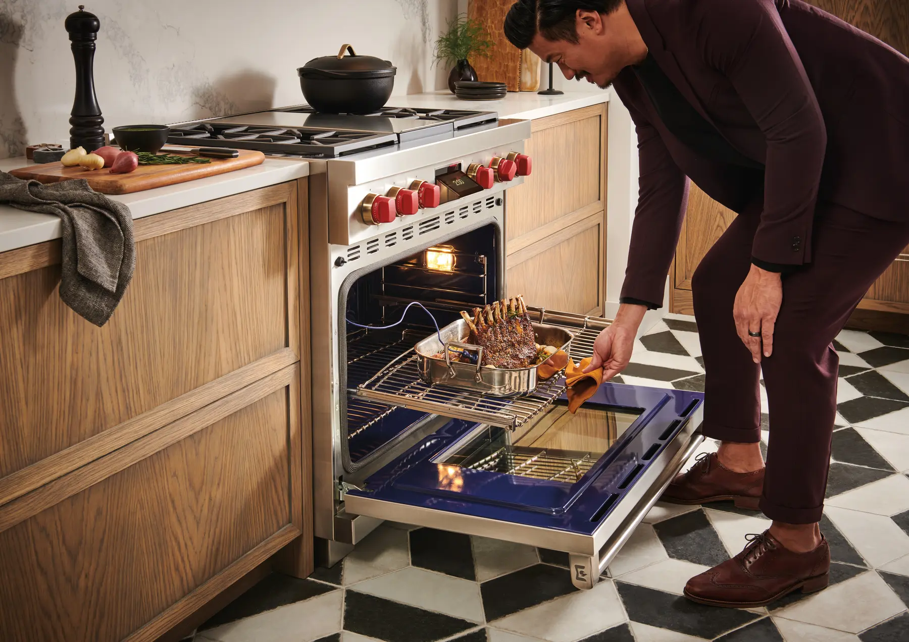 Wolf Dual Fuel Range with its electric oven open during cooking